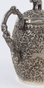 An Indian silver sugar bowl and jug adorned with animals in foliate motif and elephant finials with raised trunks, 19th century, (2 items), 12cm and 15cm high, 890 grams total - 11