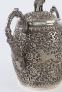 An Indian silver sugar bowl and jug adorned with animals in foliate motif and elephant finials with raised trunks, 19th century, (2 items), 12cm and 15cm high, 890 grams total - 13