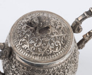 An Indian silver sugar bowl and jug adorned with animals in foliate motif and elephant finials with raised trunks, 19th century, (2 items), 12cm and 15cm high, 890 grams total - 15