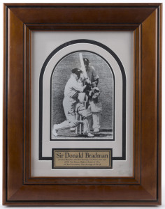 DON BRADMAN, original signature on a photograph of Bradman batting, with Godfrey Evans behind the wicket. Attractively framed. Overall 46 x 36cm.