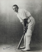 DON BRADMAN: fine signature on image showing a young Bradman in his batting stance; attractively framed and glazed, overall 41.5 x 49.5cm. - 2