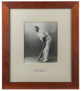 DON BRADMAN: fine signature on image showing a young Bradman in his batting stance; attractively framed and glazed, overall 41.5 x 49.5cm.