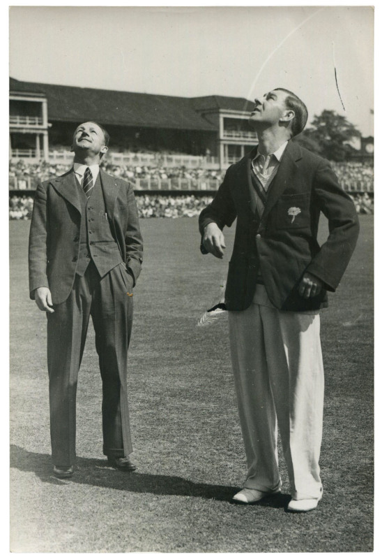 DON BRADMAN - England vs AUSTRALIA, 1948 "Invincibles" Ashes Tour: original press photograph (The Sport and General Press Agency, London), showing English captain Norman Yardley tossing the coin as a besuited Australian captain Don Bradman looks on; 10 x