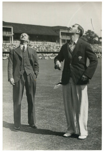 DON BRADMAN - England vs AUSTRALIA, 1948 "Invincibles" Ashes Tour: original press photograph (The Sport and General Press Agency, London), showing English captain Norman Yardley tossing the coin as a besuited Australian captain Don Bradman looks on; 10 x 15cm.