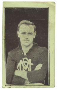 1921-25 VICTORIAN SUBURBAN PREMIUM - SOUTH MELBOURNE: Mark Tandy unnumbered card on green stock, half-length image of player with 'SMFC' logo on jersey, advertising on reverse for J.Ryan's (newsagency, Port Melbourne), Rarity Rating 7.
