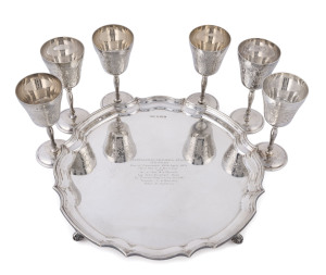 The AUSTRALIAN JOCKEY CLUB "AUSTRALASIAN CHAMPION STAKES" trophy comprising of a sterling silver serving tray and 6 sherry goblets, engraved "AUSTRALASIAN CHAMPION STAKES / 1¼ MILES / Run at Randwick 10th April, 1971 / Mr. & Mrs. C.L. Beechey / and / Mr. 