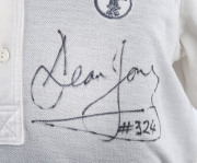DEAN JONES: A match-worn short-sleeved white Australian team shirt with ACB logo; signed below the logo "Dean Jones #324". - 2