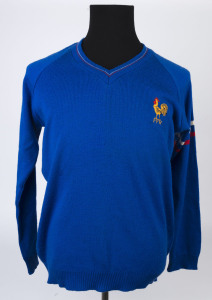 FRENCH RUGBY FEDERATION: V Neck woollen/acrylic jumper in bright blue with embroidered 'FFR' cockerel emblem on front, red & white stripes on arms; large size, made by Beverley Production (Tauranga, NZ), c.1990s.