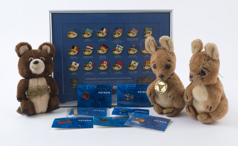 Memorabilia Selection with Sydney 2000 limited edition Olympic Games flag pin display, numbered 1378 of 2500, framed & glazed (28x36mm) plus 7 'patron' olympic badges on original presentation cards; also plush soft toy mascots for 1980 Moscow Olympics and