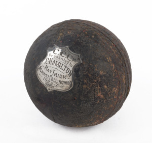 A trophy cricket ball with sterling silver shield affixed: "C.C.C. Presented to C. HAMILTON : HAT TRICK AGAINST COLLINGWOOD : 1932-3".