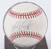 BASEBALL - KIRBY PUCKETT: signed baseball on small faux wood presentation stand, "Official Licensee/Major League Baseball" and "All Stars" (retailers) labels on base. - 2
