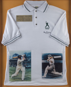 DON BRADMAN: display featuring signed Bradman Museum cricket shirt, plus two signed colour images of "The Don" strokemaking, attractively window mounted, framed & glazed, overall 87 x103cm.