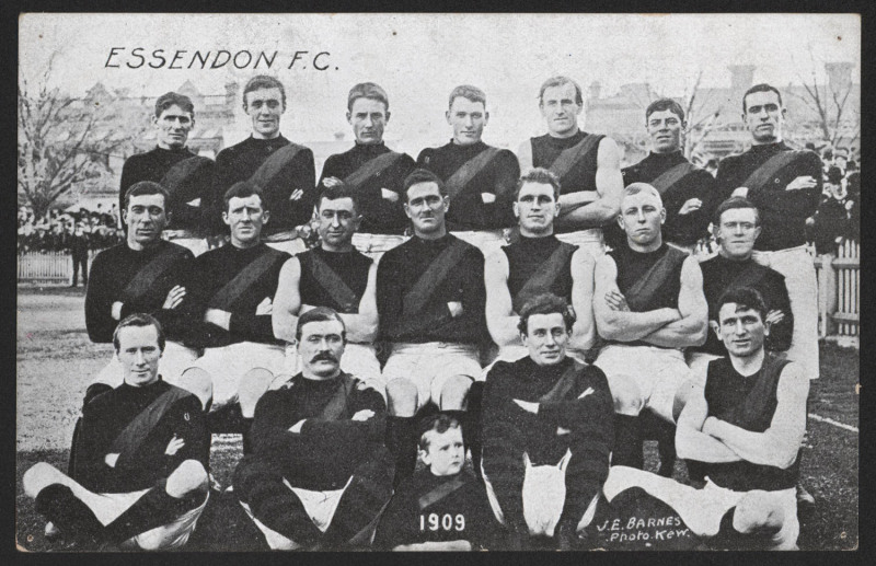 ESSENDON: 1909 postcard showing "ESSENDON F.C.", photographer J.E. Barnes (Kew), publisher Lincoln, Stuart & Co (Outfitters), unused. Good condition.