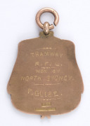 NORTH SYDNEY: Attractive 9ct gold premiership fob engraved on front "N.S.W. 1921 R.F.L." and verso, "TRAMWAY R.F.L. Won By NORTH SYDNEY. F.GUISE". ​North Sydney won the first grade premiership in 1921 and 1922. - 2