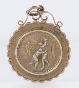 Attractive 9ct gold fob (2.5gms) with interesting scene on front and engraved verso "To E. Drury - Most unselfish player - Scrub Team 1912".