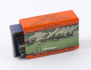 1938 CAULFIELD CUP: illustrated enamelled matchbox holder showing the finish of the 1938 Caulfield Cup, issued compliments of A.L Mulligan "The Busy Store" Campbell Town, Tasmania. Good condition.