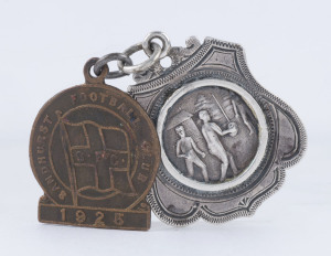 SANDHURST FOOTBALL CLUB: A most attractive sterling silver award fob with an action scene portrayed on the front and engraved verso "Presented by T.F. McCormack to W. DYSON S.F.C. 1895"; accompanied by a brass Sandhurst Football Club fob for 1925 stamped 