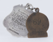 SANDHURST FOOTBALL CLUB: A most attractive sterling silver award fob with an action scene portrayed on the front and engraved verso "Presented by T.F. McCormack to W. DYSON S.F.C. 1895"; accompanied by a brass Sandhurst Football Club fob for 1925 stamped - 2