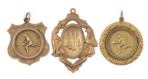 An attractive group of 9ct gold presentation fobs, comprising one with an action scene in front of gaol flanked by a kangaroo and an emu, engraved verso "Errols F. Club : P. JUECAN : PREMIERS 1921"; another engraved "M.F.C. Premiers 1930 L. BASSETT" and a
