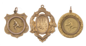 An attractive group of 9ct gold presentation fobs, comprising one with an action scene in front of gaol flanked by a kangaroo and an emu, engraved verso "Errols F. Club : P. JUECAN : PREMIERS 1921"; another engraved "M.F.C. Premiers 1930 L. BASSETT" and another, engraved "C.F.C. Leading Goal Kicker W. FRAZER 1938". (total weight: 10.1gms). (3 items).
