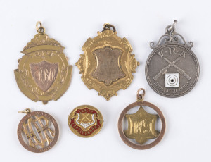 Various award fobs and badges, comprising a 9ct gold fob engraved "MECH H'CAP 2-1-15" (1.7gms); a 9ct gold fob engraved "I.O.R. Won by J. Watson 1916" (0.8gm); a 9ct gold & enamel badge (2.0gms) for Cheltenham Golf Club engraved "N.E.Cowan July 1938"; a Victorian Rifle Association sterling silver fob engraved "Sth. Melb. R.C. Won by R.G. Reid 1937"; and a 9ct gold fob (3.6gms) engraved to R.B. Urry - Van Anton Teams Race 1938". Also, a part 9ct gold fob, circa 1910 unengraved. (6 items).