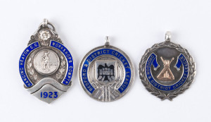 ENGLISH AWARD FOBS: A nice group of sterling silver and enamel presentation fobs for Hanging Heaton Cricket Club 1923 (runners-up), Bedford & District Cricket Club 1928 and Croydon & District Cricket League (with gold crossed bats & wickets) 1931 (Cup runners-up). (3 items).
