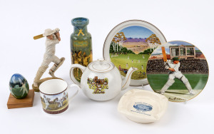 CERAMIC CRICKET MEMORABILIA: with figural piece of cricketer stroke-making (22cm high), 50th Anniversary of 1948 ("Invincibles") England Tour (23cm high) commemorative vase, cricket match illustrated "egg" mounted on wooden stand; also cricket illustrated teapot, cup (by Wedgwood), 1977 Centenary Test ashtray, plus Bradex 'Don Bradman' and Villeroy & Boch "The Cricket Match' wall plates. (8 items)