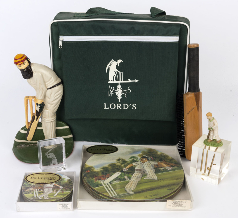 ASSORTED CRICKET MEMORABILIA: with 'W.G. Grace' cast-iron door stop, cuboid resin paperweight with internal flying cricket stumps, 'cricket bat' clothes brush, Wilscombe Design Ltd "The Cricketers" melamine table mats for plates (4) & cups (4) in original