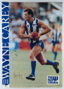 WAYNE CAREY - NORTH MELBOURNE: action image laminated poster of the North Melbourne legend, signed twice by Carey, 60x85cm.