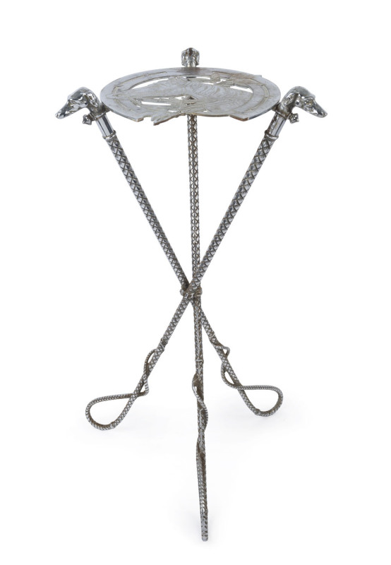 An antique, cast metal horse racing themed table, the legs formed of whips, the table top depicting a horse surrounded by an oversize horse shoe; also,a wall-mounted coat rack with similar imagery, late 19th century, (2 items).