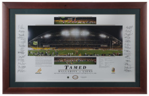 "TAMED - WALLABIES v LIONS": display celebrating Wallabies win over the British Lions in the 3rd Test at Sydney in 2001, which clinched the deciding match of the series, featuring a central action image from the game bordered by the signatures of Australi