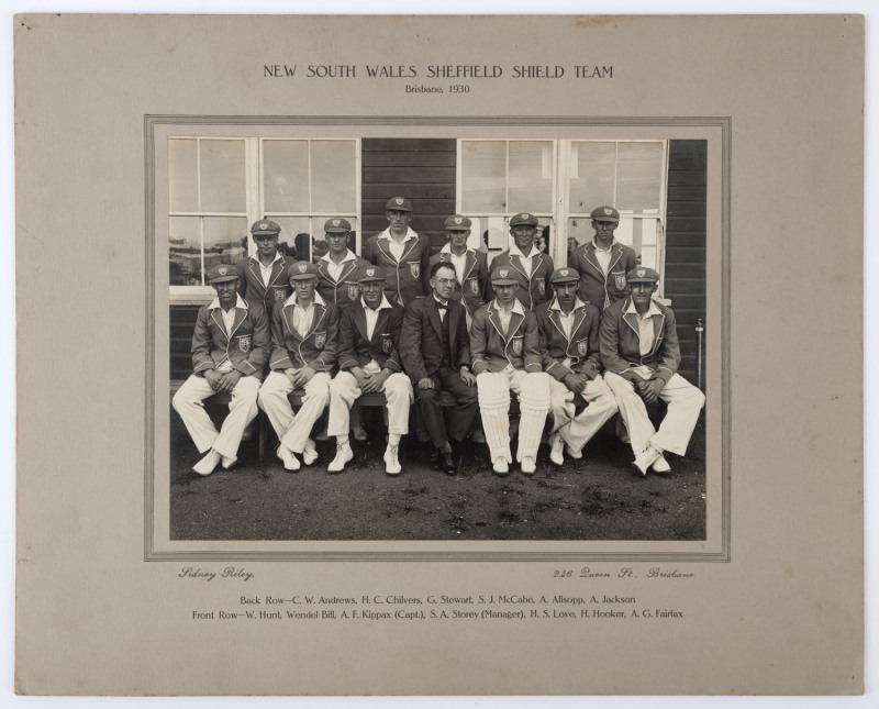 NEW SOUTH WALES SHEFFIELD SHIELD TEAM - Brisbane, 1930: The official NSW team photograph by Sidney Riley, Brisbane, with Kippax as captain and McCabe, Jackson, Fairfax and Bill in the team. Laid down on the original backing card, overall 30 x 38cm. While