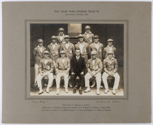 NEW SOUTH WALES SHEFFIELD SHIELD XI - Queensland, November 1929: The official NSW team photograph by Sidney Riley, Brisbane, with Oldfield as captain and young Don Bradman next to Arthur Mailey in the front row. Laid down on the original backing card, overall 30 x 38cm. While Victoria won the Shield, Bradman scored the most runs in the whole competition, 894. Provenance: From the estate of "Hal" Hooker, New South Wales.