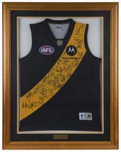 RICHMOND - 2005 SQUAD: Football Jumper (size XL) with approximately 30 signatures and CofA; window mounted, framed & glazed, overall 78 x 101cm.