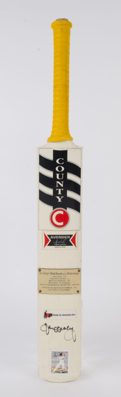 IAN HEALY: commemorative full-size County "Avenger" cricket bat with brass plate attached to face inscribed with Healy's world records as a wicket keeper, SIGNED BY HEALY beneath; good condition.