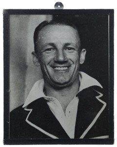 DON BRADMAN: framed portrait photo of smiling Bradman, annotated on reverse, in Bradman's hand "A reminder of our very pleasant day./Kent v Australians/at Canterbury August 23rd 1948./Don Bradman at Kennington Oval./Final Test Match August 1948; overall 21x25cm.