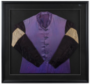 THE 1954 MELBOURNE CUP WINNER - RISING FAST: Jockey Silks believed to have been worn by Jack Purtell during the 1954 Melbourne Cup, purple body, black sleeves with pale gold bands, archivally framed, overall 86x83cm. Accompanied by a framed original press - 2