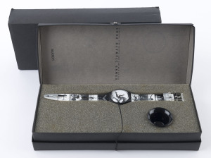 1996 ATLANTA OLYMPICS: commemorative 'Swatch' Watch, with olympic images on the watch face and strap taken by renowned photographer Annie Leibovitz; in original box as issued. As new.