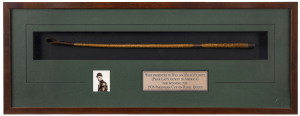 PRESENTATION WHIP - TO BILLY ELLIOTT 1936:An archivally framed whip presented to Billy Elliott on the occasion of winning the 1936 Pakenham Cup on Rebel Queen, with 9ct gold sleeve recording the details. Overall 32 x 84cm.Billy Elliott rode Phar Lap seven