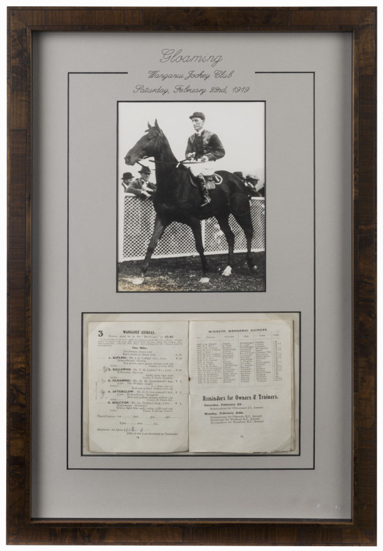 GLOAMING: Attractively framed display combining a photograph of the horse returning to scale after winning the Wanganui Guineas in February 1919, with the Wanganui Jockey Club racebook for that meeting opened to the relevant pages. Overall 55.5 x 37cm.