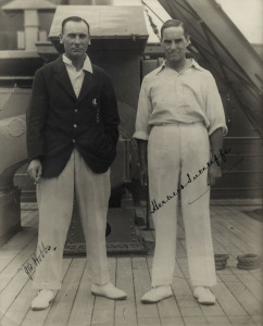 JACK HOBBS & HERBERT SUTCLIFFE, fine pen signatures on original photograph of the pair on board ship while en route to Australia, window mounted, framed & glazed, overall 38x45cm.The England cricket team toured Australia in 1928–29. England retained The Ashes, winning the first four Tests and losing the last for a 4–1 series victory.