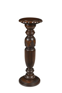 A Tudor style carved oak pedestal, early 20th century, 86cm high, top 30cm diameter