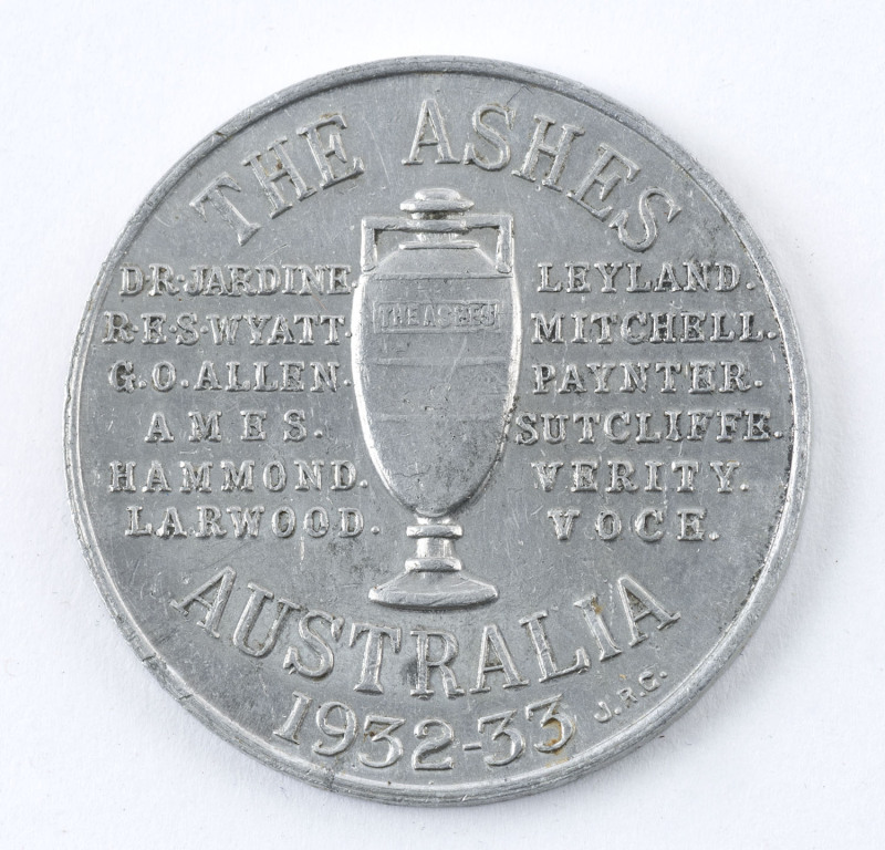 ASHES MEDALLION: in aluminium, obverse showing Ashes Trophy, and inscribed with English Test Team player names and 'AUSTRALIA 1932-33', reverse with advertising for J.R.Gaunt & Sons (silversmiths, Birmingham), 38mm diameter, weight 5.35gr