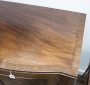 A Georgian bow front two door cabinet with book-matched flame mahogany panels, brass reeded trim and unusual vertical fluted edge, circa 1800, 86cm high, 97cm wide, 54cm deep - 4