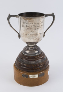 "Les Boyd Memorial Cup, St. Kilda 14 Foot Sailing Club" sterling silver trophy on wooden base with winners plaques commencing from 1946-1961, 31cm high including stand, 455 grams silver weight