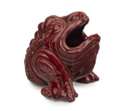 V.A.P. (Victoria Art Pottery) "Grotesque" pottery spoon warmer glazed in burgundy by WILLIAM FERRY, late 19th century, impressed stamp "V.A.P., W. F.", 14cm high, 14cm wide.
