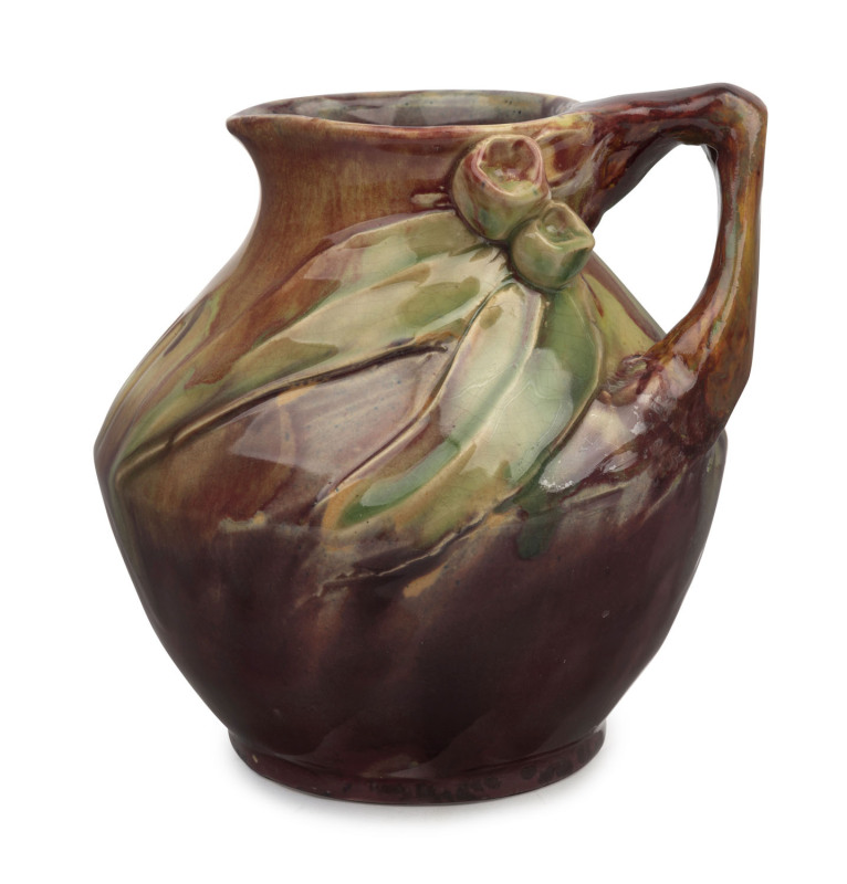 REMUED pottery jug with applied gumnuts, leaves and branch handle, early pink and purple colourway with incised decoration, incised "Remued", 16cm high, 15cm wide