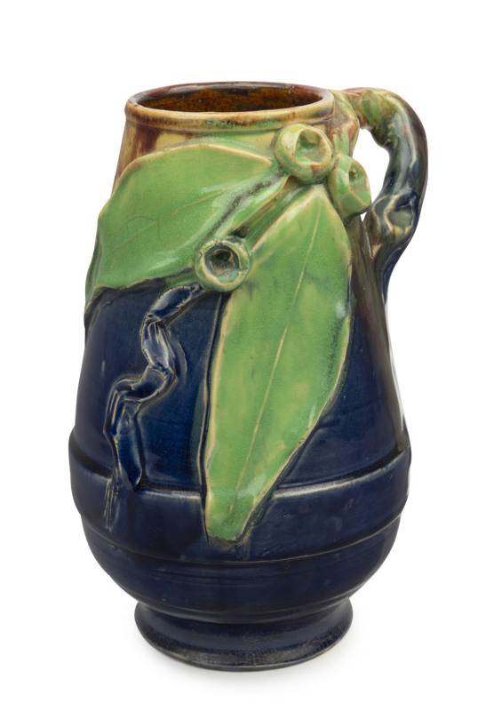 REMUED pottery mantel vase with applied gumnuts, leaves and branch handle, unusual banded decoration, incised "Remued, Hand Made", 21cm high, 13cm wide