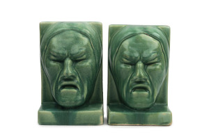 MELROSE WARE "Tragedy" pair of pottery bookends with green glazed finish, circa 1935, 17cm high, 11cm wide
