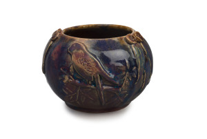 HARVEY SCHOOL pottery vase with applied parrot, gumnuts and leaves with purple, pink and blue glazes, incised "Fred......", 10.5cm high, 14cm wide